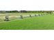 Well-manicured driving range with multiple bays, offering a great opportunity for practice at 2586 Lancaster Ridge, Davenport, FL 33837