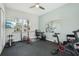Bright workout room with a ceiling fan, weights and gym equipment at 2586 Lancaster Ridge, Davenport, FL 33837