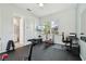 Bright workout room with a ceiling fan, weights and gym equipment and ensuite bath at 2586 Lancaster Ridge, Davenport, FL 33837