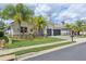 Beautiful single-Gathering home with a three-car garage, lush landscaping, and well-maintained lawn at 2586 Lancaster Ridge, Davenport, FL 33837