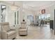 Open-concept dining and living area featuring tile flooring, high ceilings, and comfortable seating at 2586 Lancaster Ridge, Davenport, FL 33837