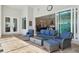 Inviting outdoor living space with stylish seating, a cozy fire pit, and a view of the well-maintained pool area at 2586 Lancaster Ridge, Davenport, FL 33837