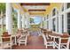 Inviting outdoor seating area with covered patio and views of the surrounding landscape at 2586 Lancaster Ridge, Davenport, FL 33837
