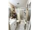 Cozy bathroom features a shower-tub combo, updated fixtures, and a modern vanity with storage at 2716 Upsandown St, Orlando, FL 32837