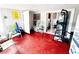 Bright sunroom with sliding glass doors and red painted concrete floor at 2716 Upsandown St, Orlando, FL 32837