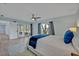 Light-filled bedroom with french doors to the garden, ceiling fan, and comfy bed at 277 Sunrise Pt, Lake Mary, FL 32746