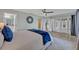 Spacious bedroom with closet, a circular mirror, a plush rug, and french door access at 277 Sunrise Pt, Lake Mary, FL 32746
