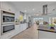 Spacious kitchen featuring stainless steel appliances, stone countertops and abundant storage at 277 Sunrise Pt, Lake Mary, FL 32746