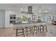 Bright and modern kitchen with stainless steel appliances and a large marble-topped island at 277 Sunrise Pt, Lake Mary, FL 32746
