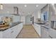 Modern kitchen with stainless steel appliances, stone countertops and a large center island at 277 Sunrise Pt, Lake Mary, FL 32746