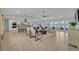 Bright, open-concept living room with modern furnishings and access to scenic outdoor views at 277 Sunrise Pt, Lake Mary, FL 32746