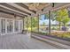 Enjoy outdoor living on this covered patio overlooking the lake and backyard at 277 Sunrise Pt, Lake Mary, FL 32746