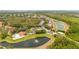 An aerial view captures community amenities like a pool, fountain pond, gated entry, and lush landscaping at 2805 Lido Key Ct, Kissimmee, FL 34747