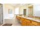 Bathroom featuring a soaking tub, separate shower, and vanity with granite counters at 2805 Lido Key Ct, Kissimmee, FL 34747