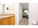 Bathroom featuring a granite countertop vanity and access to the adjacent bedroom space at 2805 Lido Key Ct, Kissimmee, FL 34747