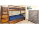Bedroom features carpet, neutral walls and a wood bunk bed with a dark blue mattress at 2805 Lido Key Ct, Kissimmee, FL 34747