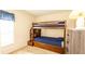 Bedroom features carpet, neutral walls and a wood bunk bed with a dark blue mattress at 2805 Lido Key Ct, Kissimmee, FL 34747