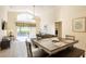 Open dining area with a view to living room and sliding glass doors to the pool, plus modern furnishings at 2805 Lido Key Ct, Kissimmee, FL 34747