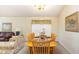 Bright dining room featuring a wooden table with seating for six, ideal for Gathering meals at 2805 Lido Key Ct, Kissimmee, FL 34747