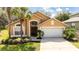 Charming single-Gathering home with a well-manicured lawn and a two-car garage at 2805 Lido Key Ct, Kissimmee, FL 34747