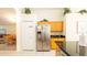 Bright kitchen with stainless steel refrigerator, stylish countertops, and open view to the living space at 2805 Lido Key Ct, Kissimmee, FL 34747