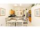 Bright kitchen with tile flooring, bar seating, and open concept design connecting to the living space at 2805 Lido Key Ct, Kissimmee, FL 34747