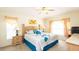 Bright bedroom with a ceiling fan, soft lighting, and a comfortable bed at 2805 Lido Key Ct, Kissimmee, FL 34747