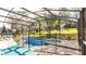 Beautiful backyard with an enclosed pool and lounge furniture for entertaining guests at 2805 Lido Key Ct, Kissimmee, FL 34747