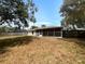 Spacious backyard with room for outdoor enjoyment and mature trees at 3090 Yorkshire Dr, Deltona, FL 32738