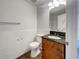 Traditional bathroom with tile flooring, single sink vanity, and toilet at 3090 Yorkshire Dr, Deltona, FL 32738