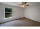 Bedroom with window offering exterior view at 3090 Yorkshire Dr, Deltona, FL 32738