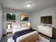 Comfortable bedroom with neutral walls, soft lighting, and modern decor at 3090 Yorkshire Dr, Deltona, FL 32738