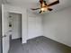 Bedroom with a ceiling fan and a closet for storage at 3090 Yorkshire Dr, Deltona, FL 32738