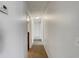 Neutral hallway with carpet flooring and a simple overhead light fixture at 3090 Yorkshire Dr, Deltona, FL 32738