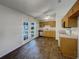 Inviting kitchen with warm wood cabinets and a view to the serene backyard at 3090 Yorkshire Dr, Deltona, FL 32738