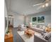 Bright living room with neutral walls, large windows, comfortable seating, and stylish decor at 3090 Yorkshire Dr, Deltona, FL 32738