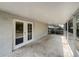 Covered patio with screen and open space at 3090 Yorkshire Dr, Deltona, FL 32738