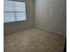 This bedroom has tile floors and one window at 3265 Stratton Cir, Kissimmee, FL 34744
