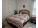 Cozy bedroom with a comfortable bed, side table with lamp, and a window at 3265 Stratton Cir, Kissimmee, FL 34744