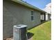 Exterior of home showing AC Unit, and screened porch at 3265 Stratton Cir, Kissimmee, FL 34744