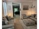 Inviting living room with neutral tones, tile floors, and ample seating for Gathering and friends at 3265 Stratton Cir, Kissimmee, FL 34744