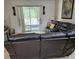 Spacious living room features a leather couch at 3265 Stratton Cir, Kissimmee, FL 34744