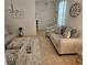 Comfortable living room features tile flooring, neutral walls, and stylish furniture at 3265 Stratton Cir, Kissimmee, FL 34744