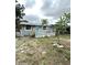 Charming single-story home with a cozy front porch, with neutral paint and minimal landscaping at 332 S Observatory Dr, Orlando, FL 32835