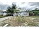 Cozy one-story home with a quaint front porch, simple design, and easy access to neighborhood amenities at 332 S Observatory Dr, Orlando, FL 32835