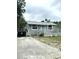 Charming one-story home featuring a inviting front porch and easy driveway access and minimal landscaping at 332 S Observatory Dr, Orlando, FL 32835