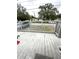 View from the front porch with painted deck, offering a glimpse of the neighborhood at 332 S Observatory Dr, Orlando, FL 32835