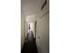 Hallway view with wood-look floors leading to the living spaces of the home at 332 S Observatory Dr, Orlando, FL 32835