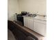 Efficient kitchen setup with appliances, cabinets and a sleek countertop at 332 S Observatory Dr, Orlando, FL 32835