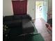 Comfortable living room with sectional sofa and access to a doorway filled with natural light at 332 S Observatory Dr, Orlando, FL 32835